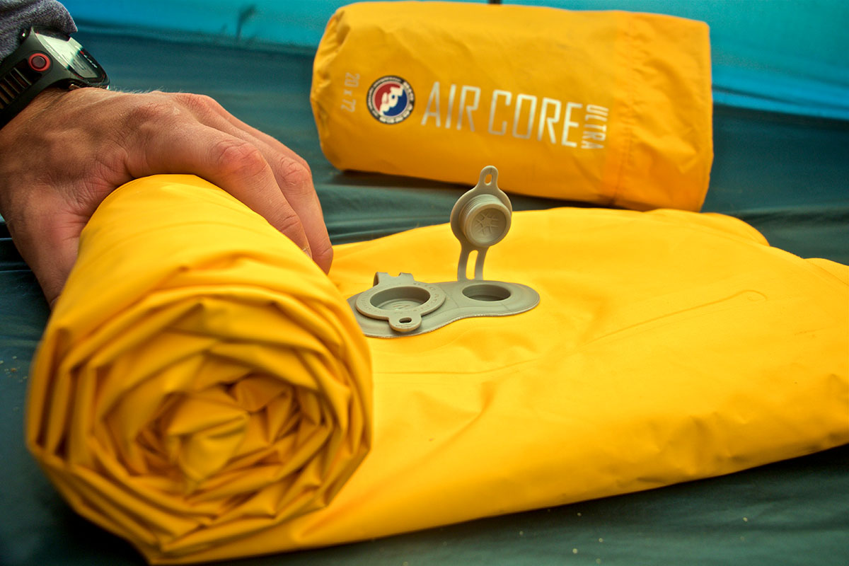 Sleeping pad (Big Agnes Air Core Ultra rolled up)