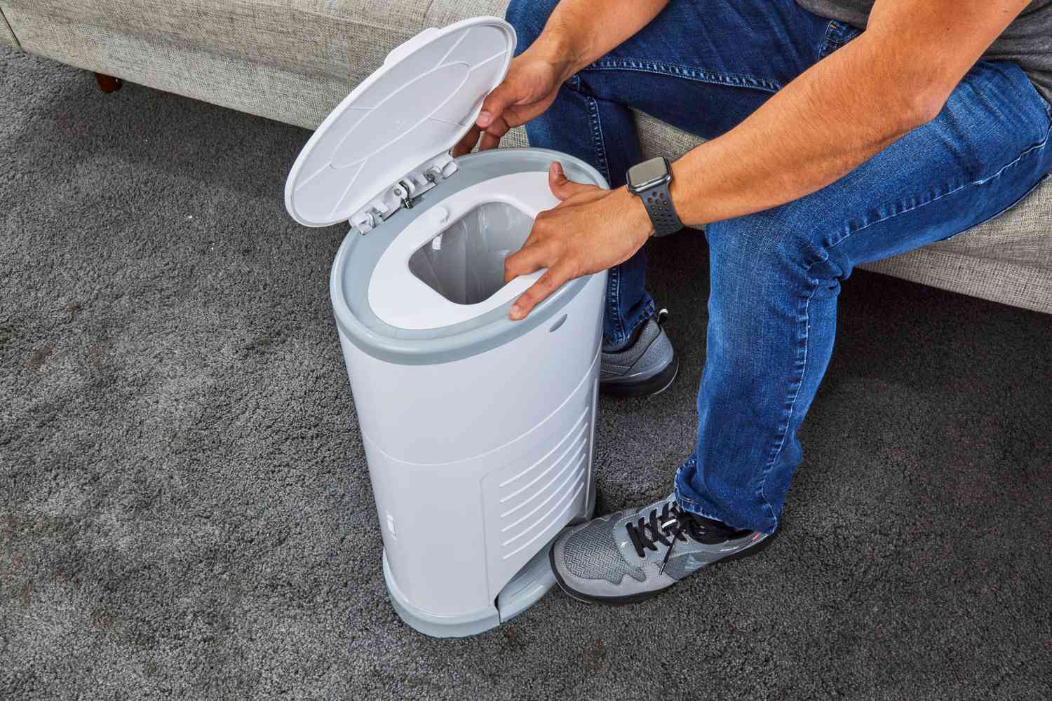 The top flap on the Dekor Plus Hands-Free Diaper Pail is pressed